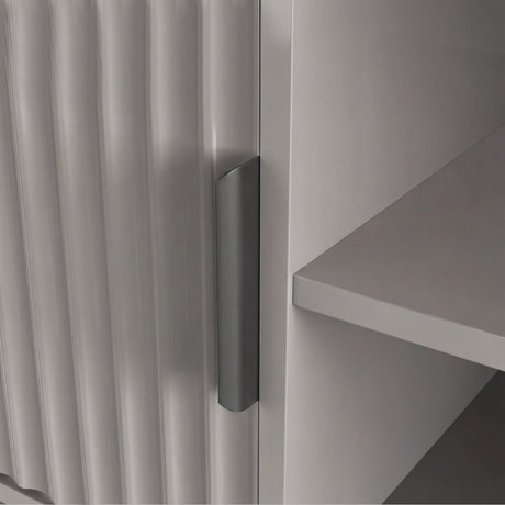 Front view of a grey TV entertainment unit with textured vertical slats, open shelving, and grey handle.