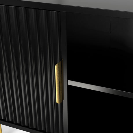 Front view of a black TV entertainment unit with vertical fluted doors, open shelves, and slim golden metal handle.