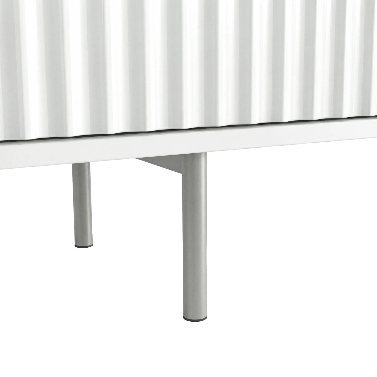 [White]  Close-up of white Flutrina TV unit base, ribbed door bottom and slim chrome cylindrical metal leg