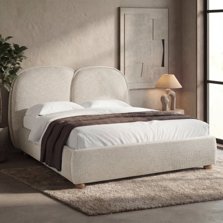 [King | Beige] Upholstered bed frame with a soft padded headboard and wooden legs in a natural light bedroom setting