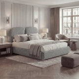 Double Bed frame with fabric-wrapped surfaces, softly contoured back support, and layered textiles