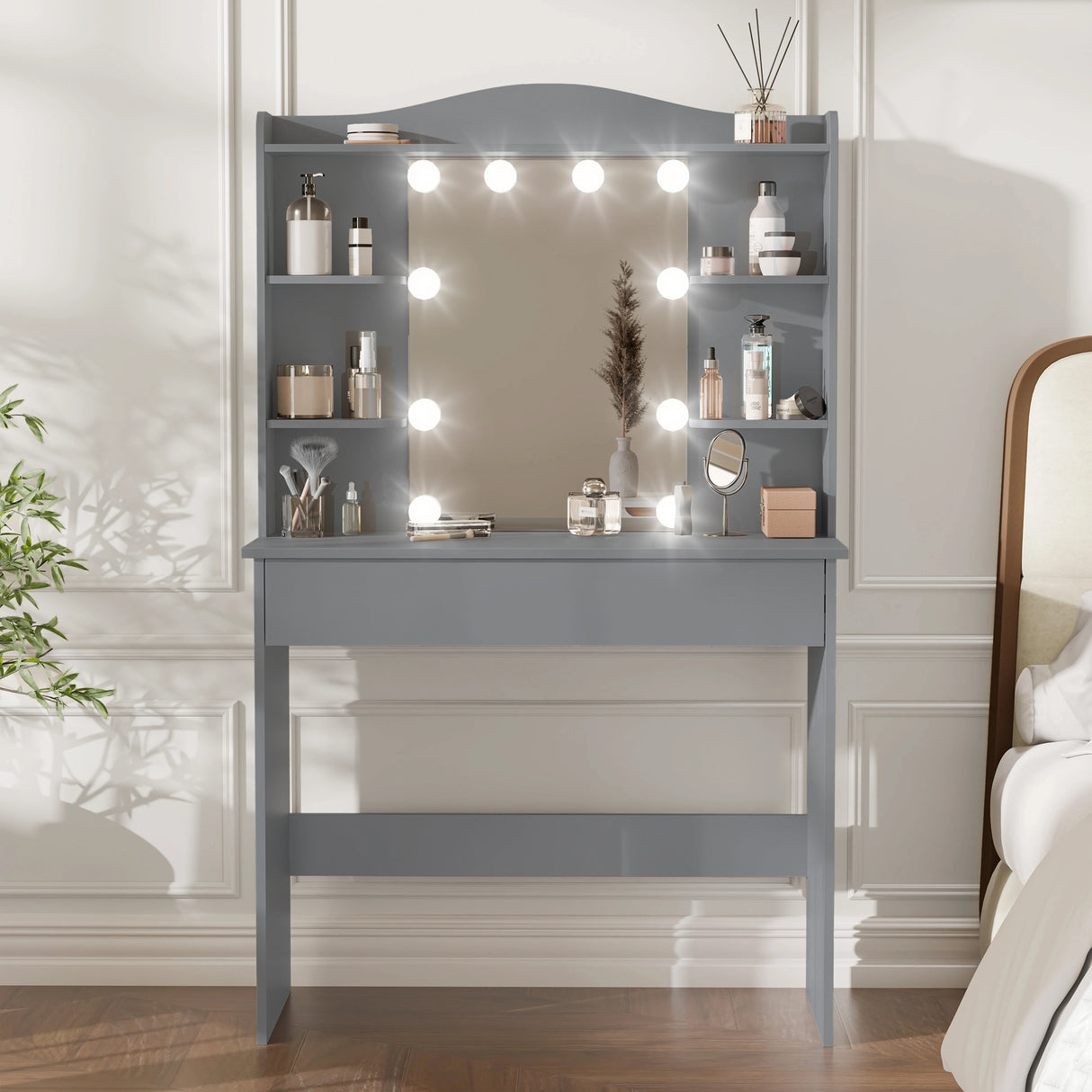 Gray vanity with mirror and lights in a bedroom setting