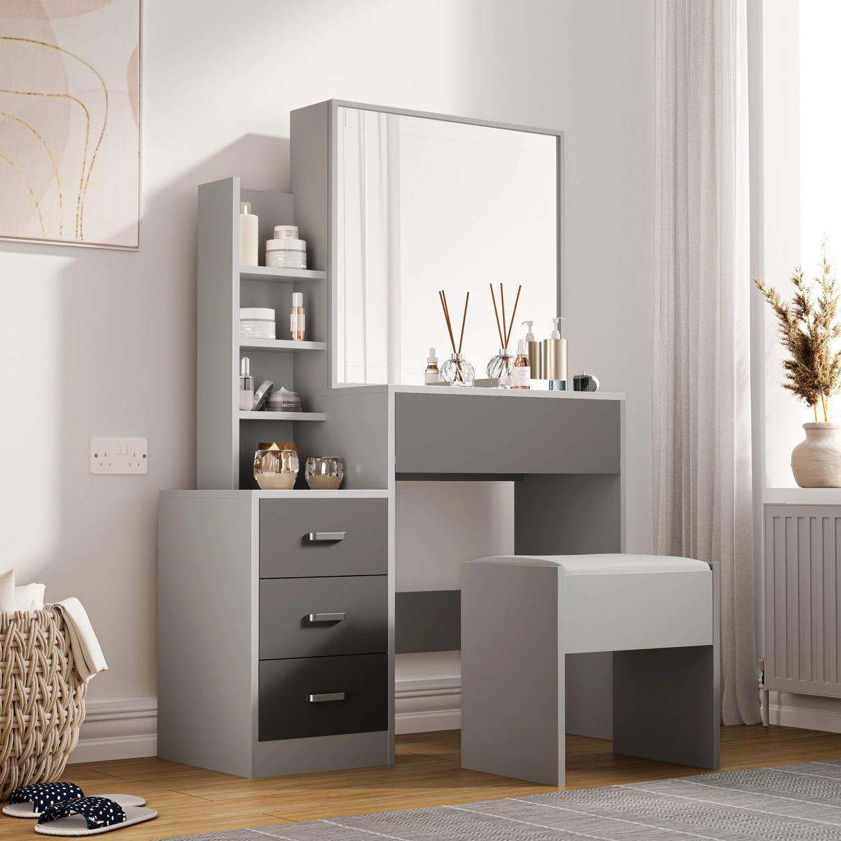 Modern grey dressing table with storage, drawers, and mirror. Includes open shelves, four drawers, and a cushioned stool for bedroom use.