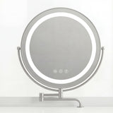 Makeup table with a round illuminated mirror and adjustable lighting settings, showcasing a modern and sleek design