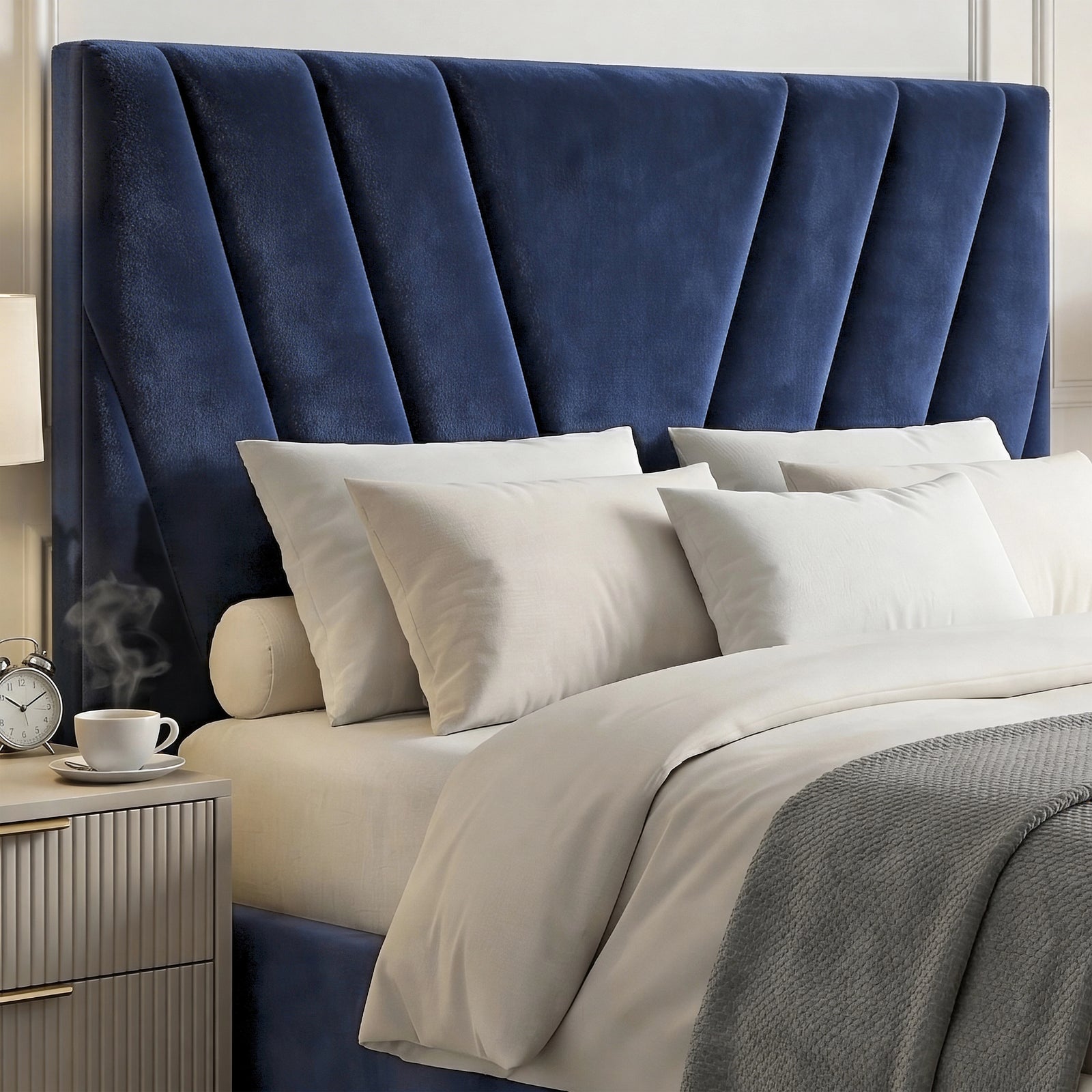 [Double | Blue] navy blue velvet ottoman bed headboard with V-chevron stitching and reeded pale nightstand at left
