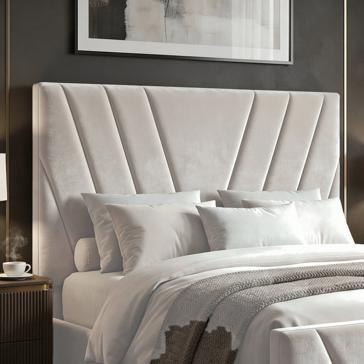[Double | Beige] beige velvet ottoman bed headboard with V-chevron channels fanning from lower centre, white pillows in front