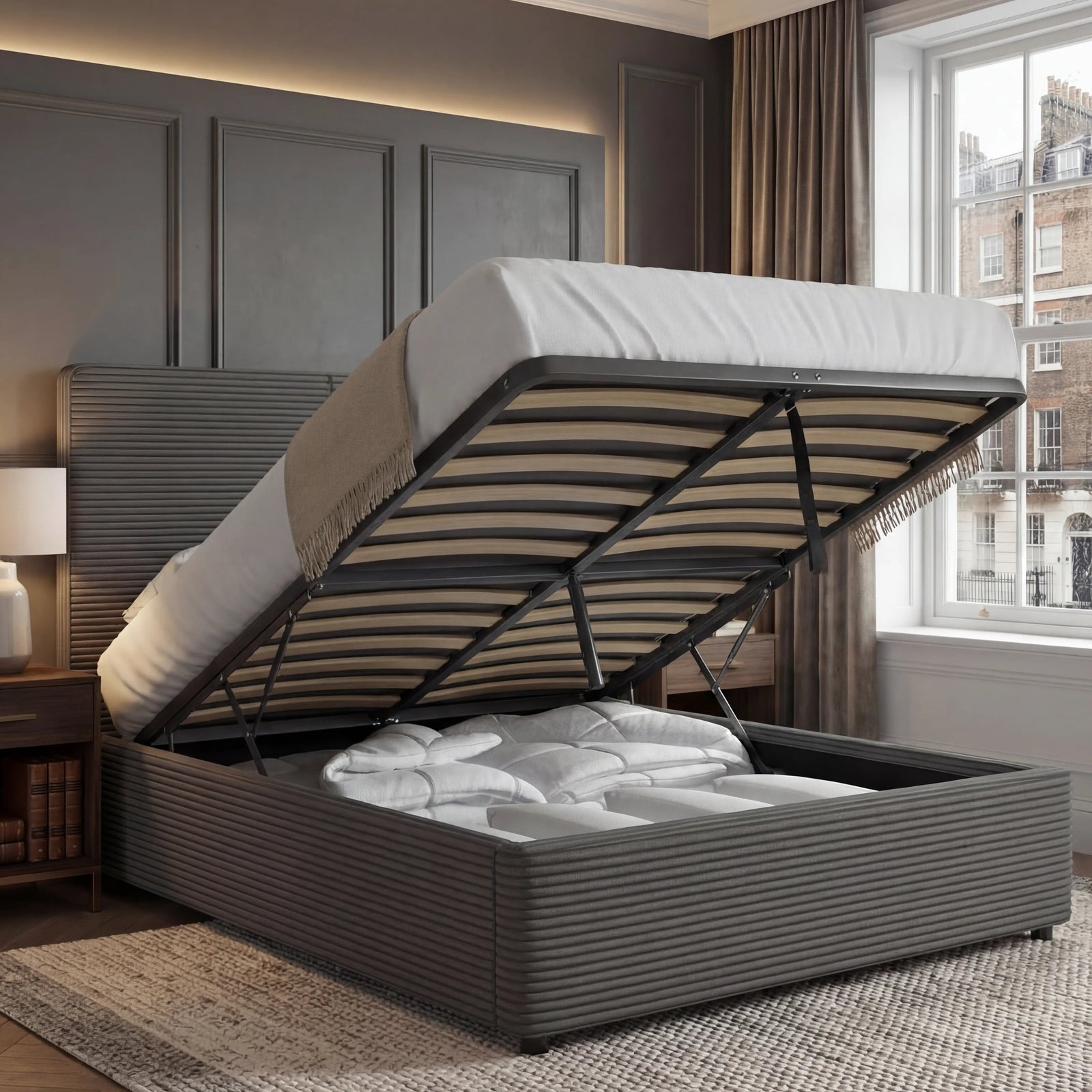 [Double | Grey] Velvet ottoman bed base tilted up, double size, storage compartment full of bedding against panelling