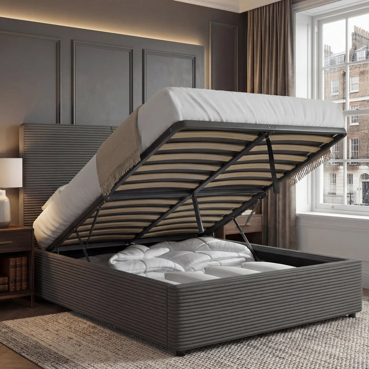 [Double | Grey] Velvet ottoman bed base tilted up, double size, storage compartment full of bedding against panelling