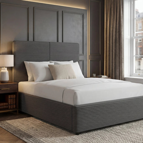 [King | Grey] King velvet ottoman bed in dark grey with ribbed headboard and footboard in a panelled bedroom