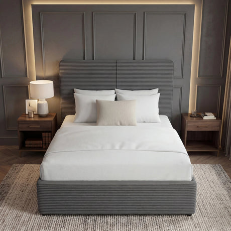 [King | Grey] Full view of king velvet ottoman bed in dark grey, cream bedding and throw pillows on top