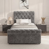 Front view of single dark grey ottoman storage bed with tufted headboard and cushioned base