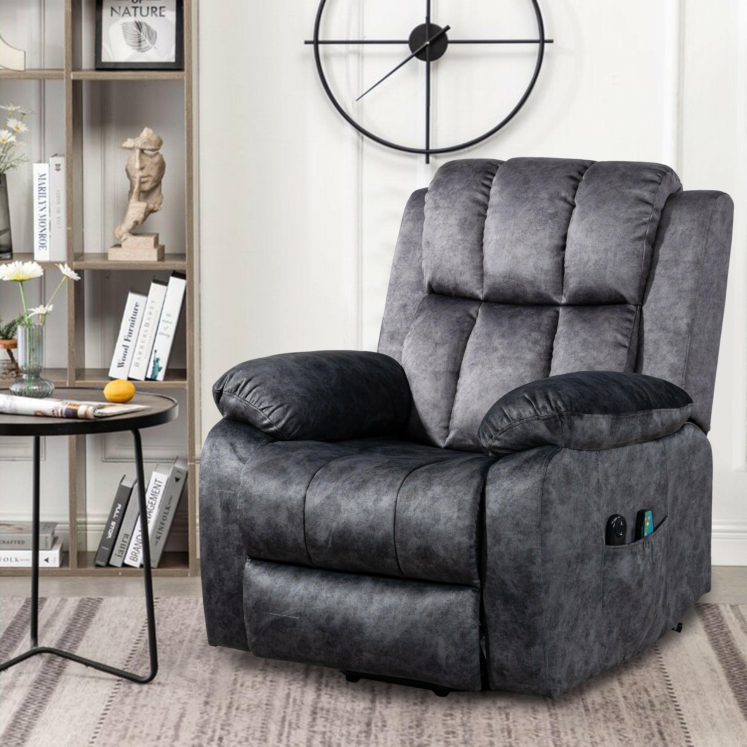 Luxurious velvet recliner armchair in dark grey, featuring padded cushions and side pockets.