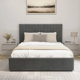 Gray upholstered bed with white bedding in a bedroom setting.