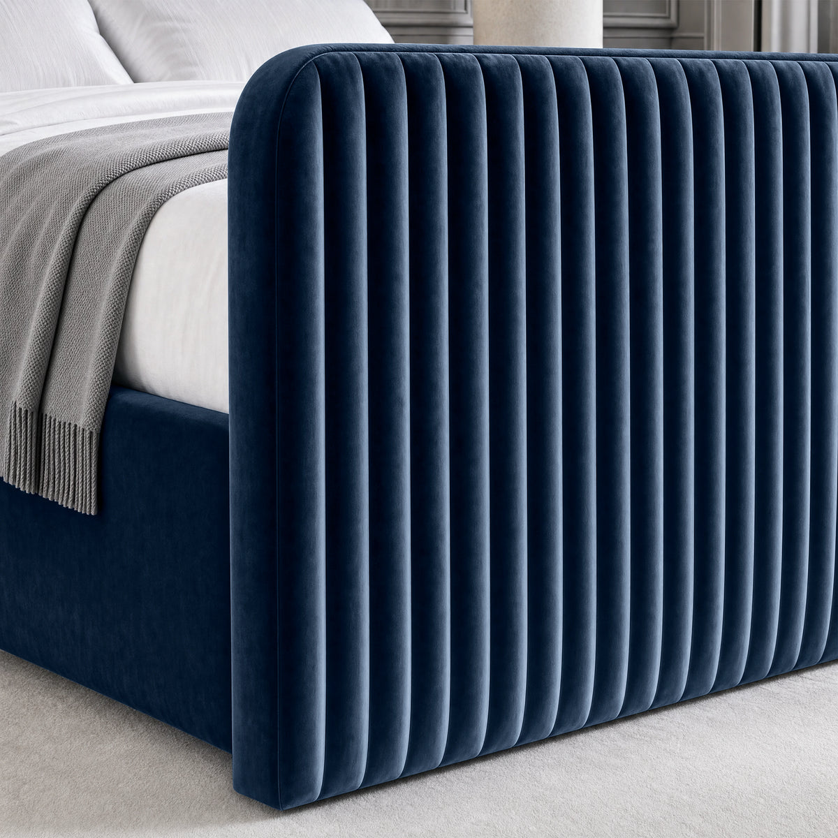 [Blue | King] Close-up of 62cm tall padded footboard corner showing plush fabric and bed base detail