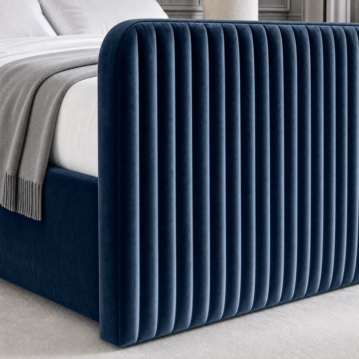 [Blue | King] Close-up of 62cm tall padded footboard corner showing plush fabric and bed base detail