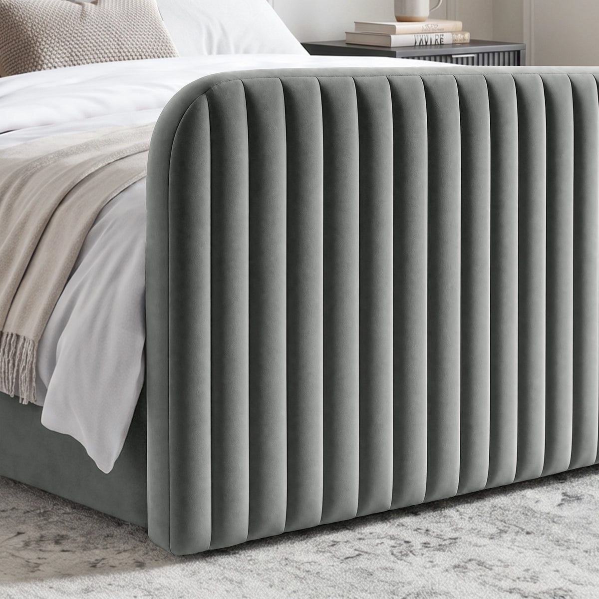 [Grey | King] Close-up of 62cm tall padded footboard corner showing plush fabric and bed base detail