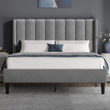 [Double | Light Grey] Front view of velvet bed with vertical channel-tufted winged headboard and tapered dark legs
