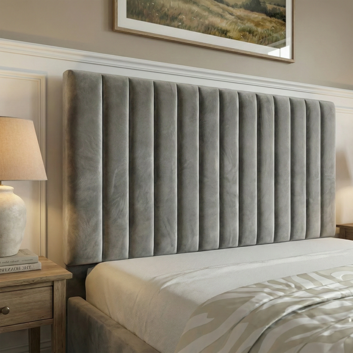 [Grey | King] ottoman bed headboard close-up displaying tall vertical pleats in velvet with landscape art visible above