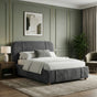 [Double | Dark Grey] Side angle of fabric bed with curved wingback headboard in sage green panelled room with gold trim