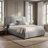 [Double | Grey] Textured fabric bed with channel-stitched curved headboard against warm moulded wall with natural daylight