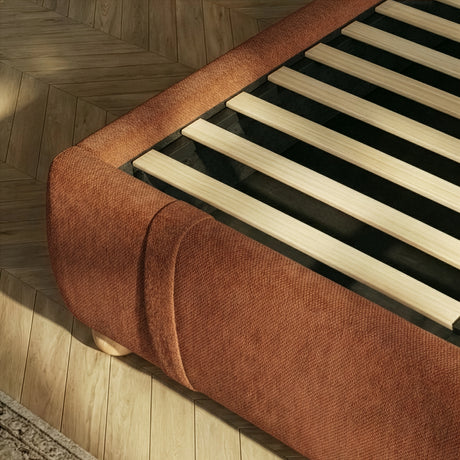 [King | Orange] Bed frame base showing wooden slats and rounded footboard corner from above