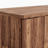 [Dark Bronx] Top corner detail of walnut wardrobe highlighting natural grain pattern and sharp panel edges