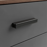 [Walnut] Close up of walnut grey drawer front with matte black wooden handle and smooth painted surface