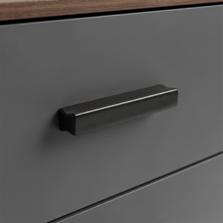 [Walnut] Close up of walnut grey drawer front with matte black wooden handle and smooth painted surface
