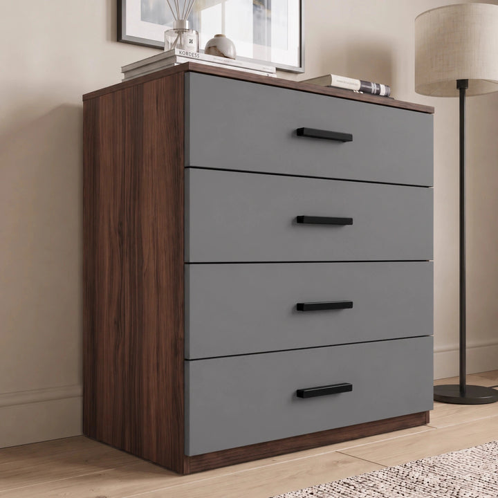 [Walnut] four drawer chest styled in a neutral interior with soft lighting and decorative accents