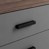 [Walnut] Close view of black wooden handle fixed to grey drawer front framed by walnut side panels