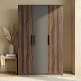 [Walnut+Grey] triple door wardrobe front view with dual tone finish and centered black handles placed against a wall in a bright lit room