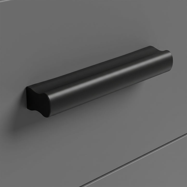 [Walnut] Close-up view of the sleek black handle on the Walnut 5 Drawer Chest grey drawer front.