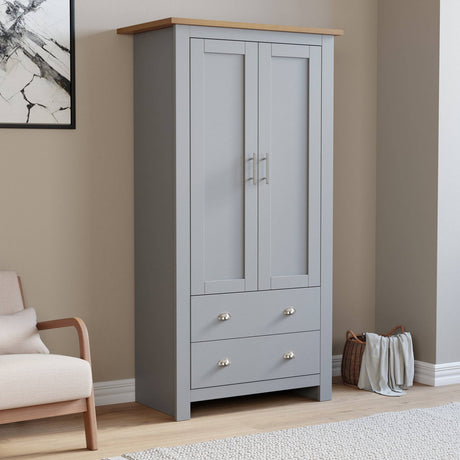 2 door grey wardrobe with drawers, part of a modern bedroom furniture set. Features silver handles and wood-effect top for stylish storage.