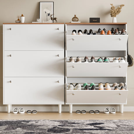Two slim shoe cabinet units in white oak top, one drawer open showing shoes and wellies, bag on hook, decor placed on top.