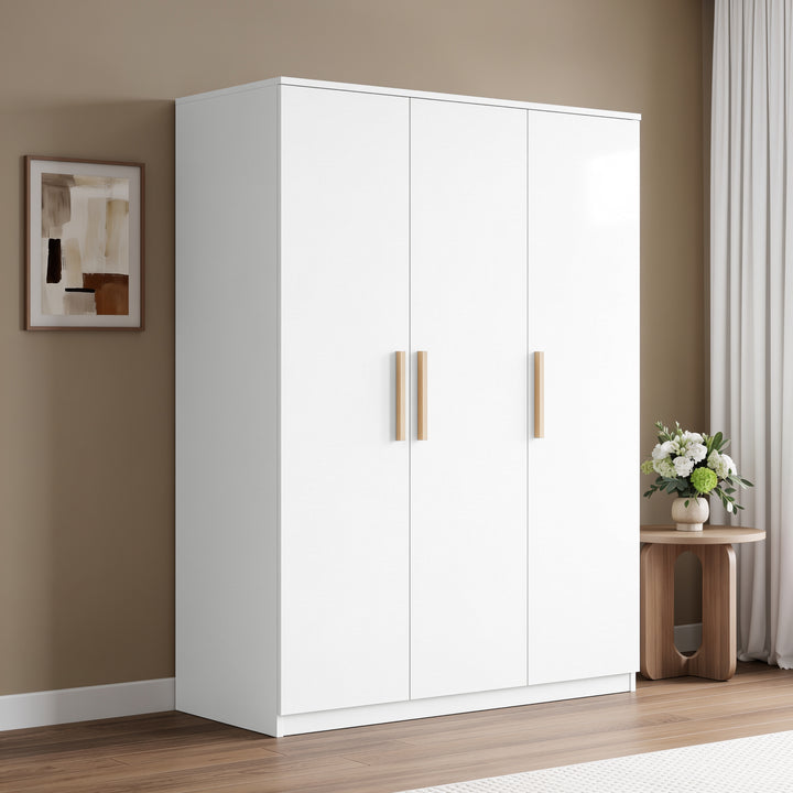 [White] Angled bedroom view of a closed three door wardrobe with pale wood handles beside a round side table