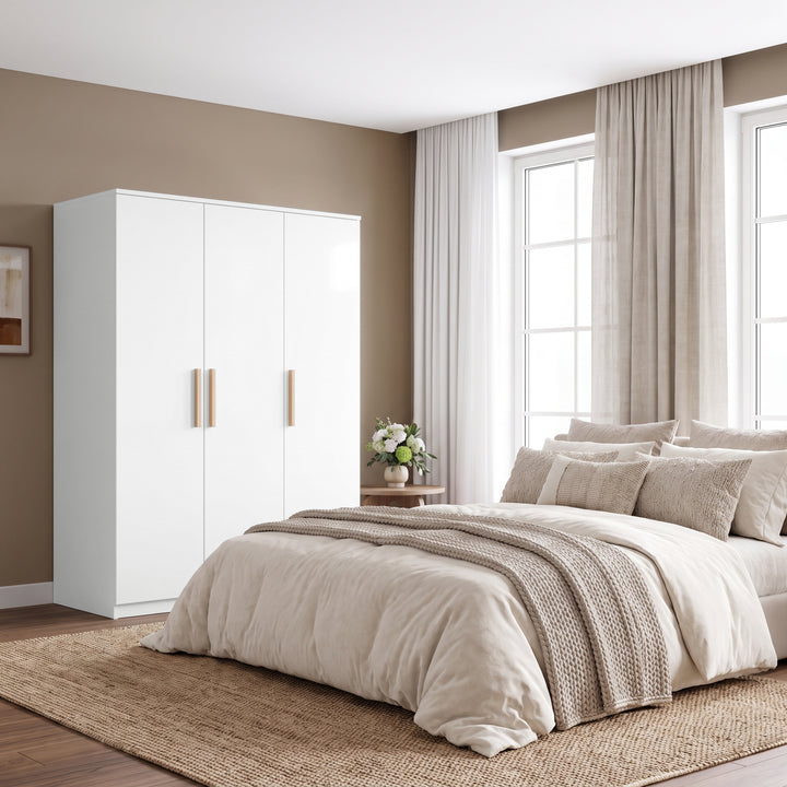 [White] Bedroom lifestyle view with a closed three door wardrobe beside a bed, window curtains, and side table