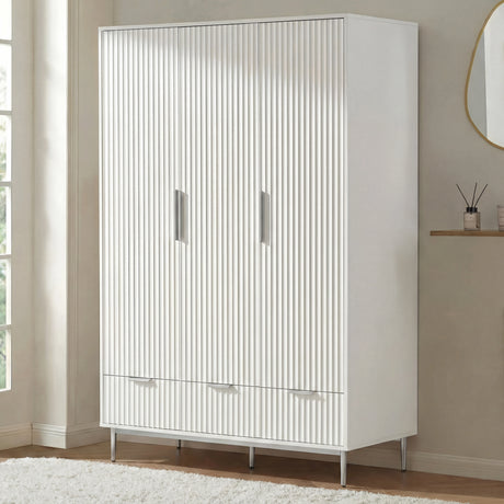 White three door wardrobe with lower drawers placed in room setting with soft neutral decor