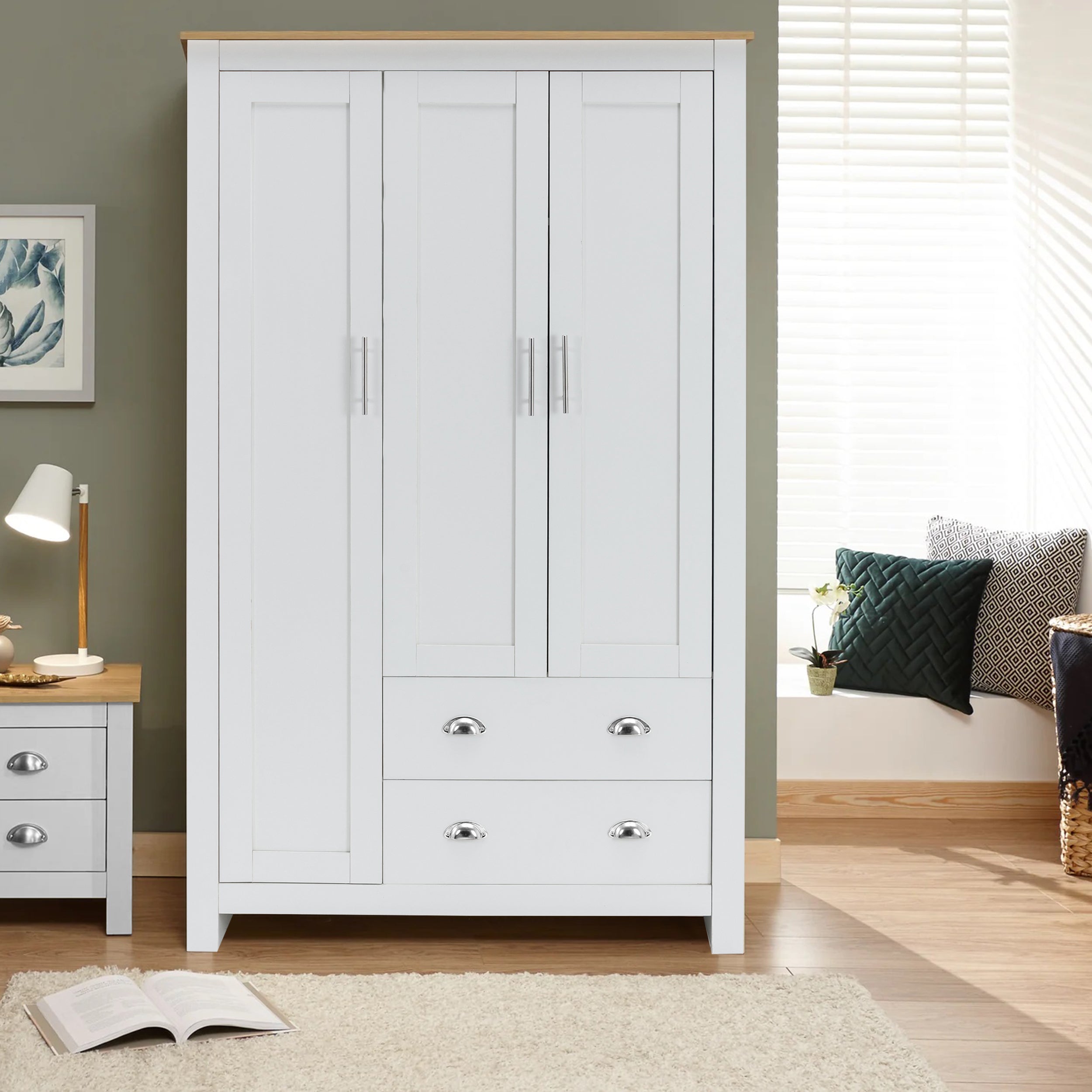 White 3-door wardrobe with oak top, featuring chrome handles and two bottom drawers for storage.