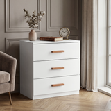 [White] three drawer chest placed in room beside window with clean lines and wooden horizontal handles