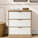 Skova 3 Piece Bedroom Furniture Set chest of drawers with three white drawers and oak-effect frame, ideal for modern UK bedrooms.