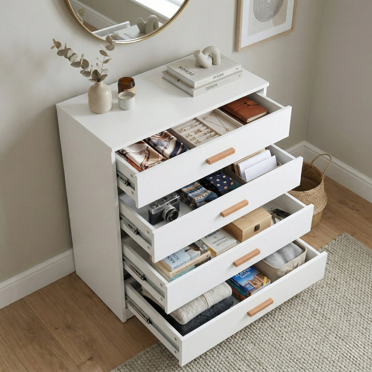 [White]  four drawer chest shown at angle with drawers open, revealing depth and usable storage space