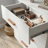 [White] Close view of white chest top drawer interior showing organised storage space and smooth inner panels