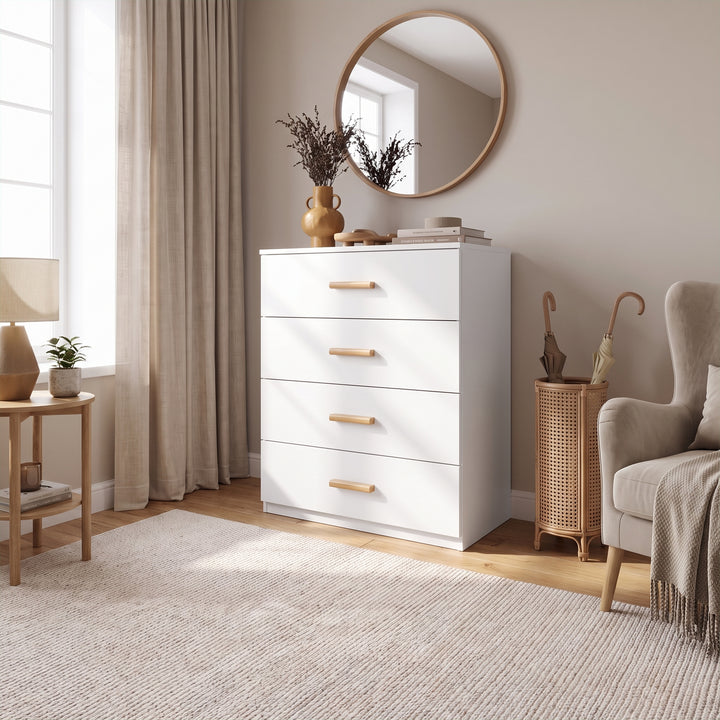 [White] White 4-drawer chest with wood handles placed on a beige rug next to an armchair in a cozy living room decor