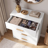 [White] Top-down view of a white chest of drawers showing the top drawer open with neatly organized sweaters, ties, and watches