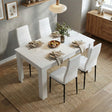 [4 Seater | White] White 4-6 Seater Dining Table and Chairs Set elevated view showing a table arranged with matching faux-leather high-back chairs on a textured woven rug
