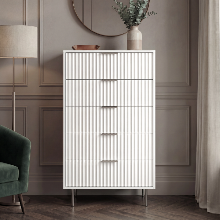 [White] five drawer bedroom chest front view with vertical flutrina detailing and silver metal handles