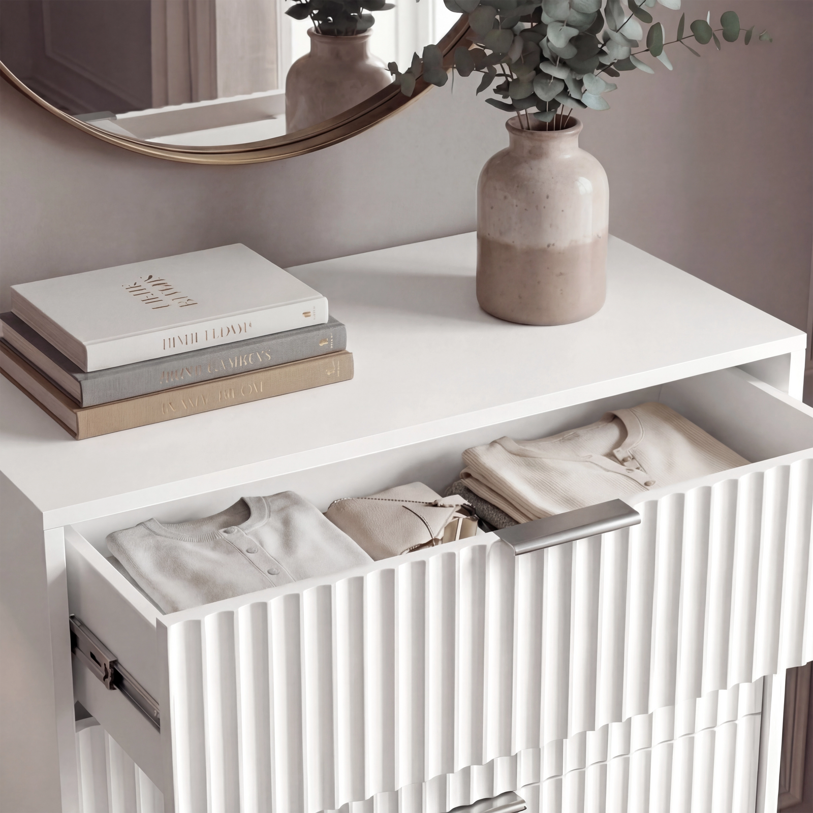 [White] Close detail of white flutrina drawer front with silver metal handle and vertical textured panel design