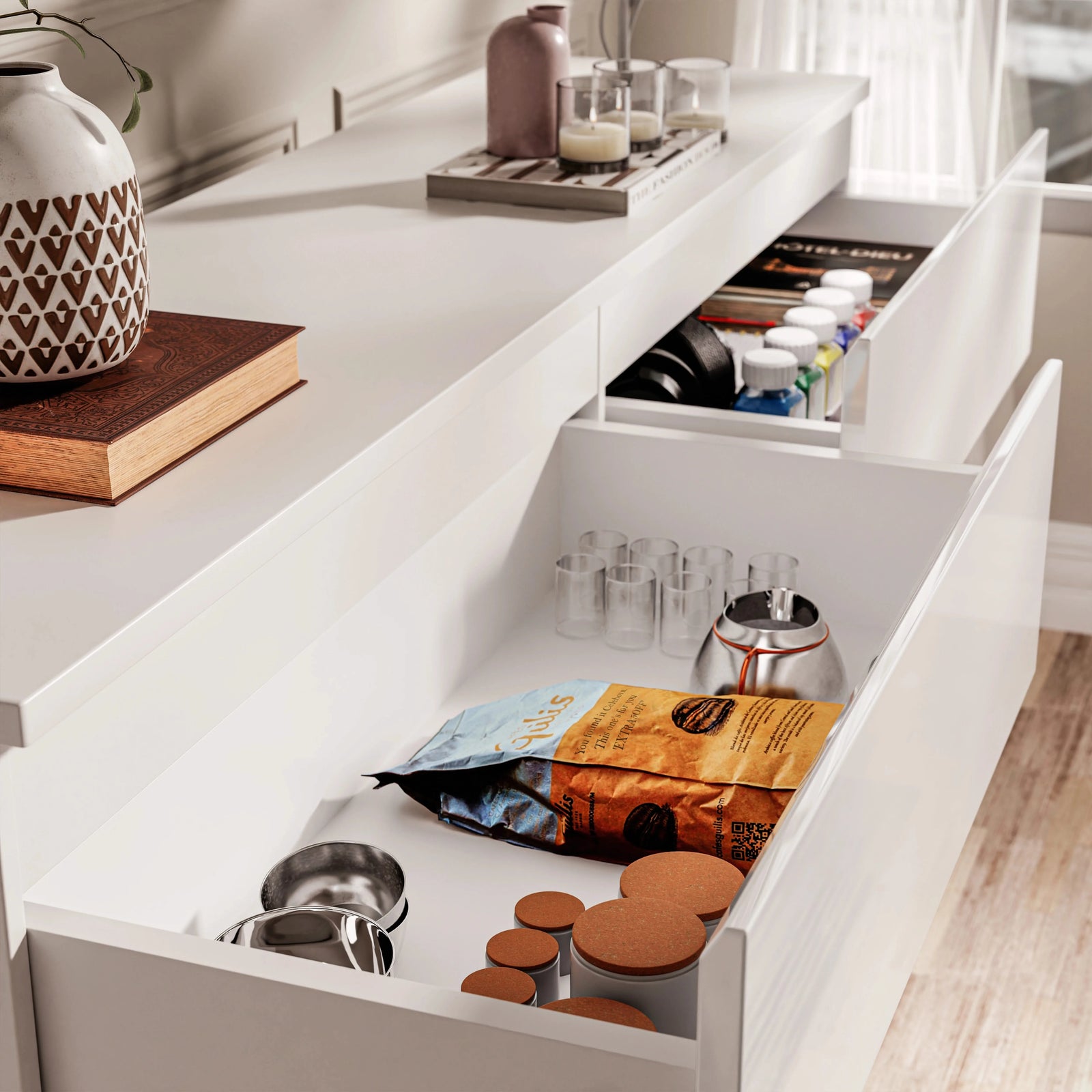 [White] Detail of 6 drawer chest with top-left drawer open and second drawer slightly ajar.