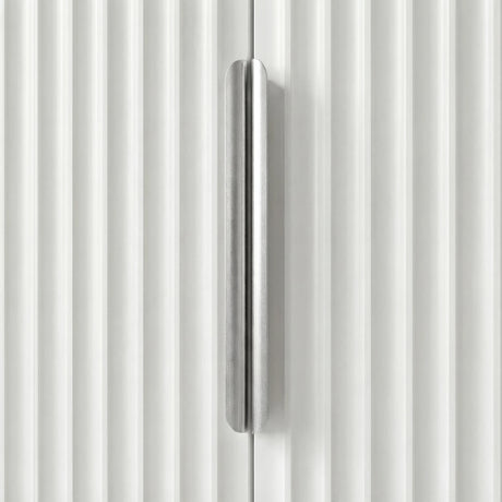 Close view of white wardrobe, silver metal handle mounted vertically on the flutrina door panel