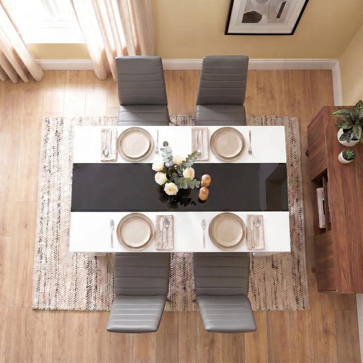 [4 Seater | Grey] White & Black Gloss 4-6 Seater Dining Table photographed from directly above with four grey chairs and four beige place settings on a woven rug
